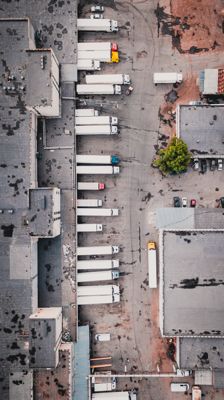 Overview image of trucks docked at a warehouse